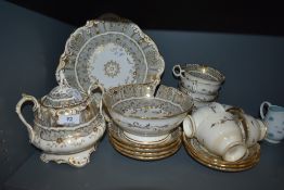 An antique partial tea service having cream and grey ground with gilt motif detailing,AF.