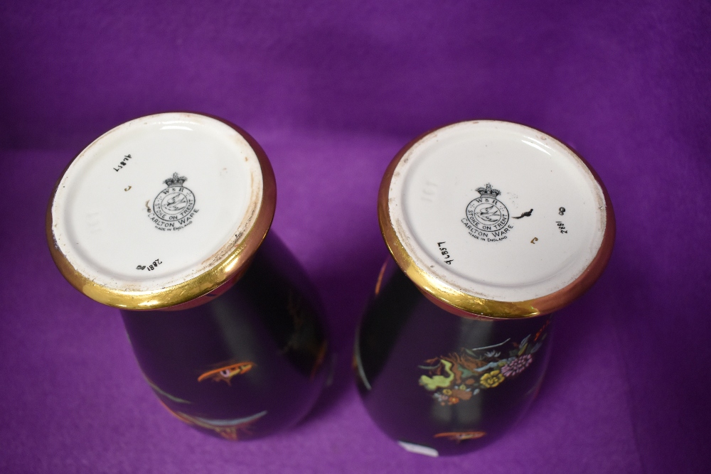 A pair of Carlton ware vases having black ground with orange accents,oriental styled scenes and gilt - Image 2 of 2