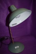 A vintage style posable desk lamp in duck egg blue.