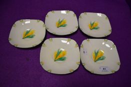 A set of five tea saucers by Paragon with hand decorated designs