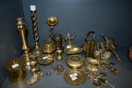 An assortment of brass amongst which are Egyptian styled ash tray,trivet, hooks,two WW2 shell