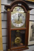 A Vienna styled wall clock marked Tempus Fugit in wooden case.