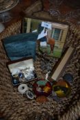 A basket full of bits and bobs including Wade hedgehog, coins, badges and more.