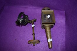 An antique brass coach lamp and a wall mounted light fitting,possibly originally a gas light which