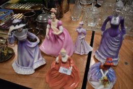 A collection of figurines including Coalport and Royal Doulton.