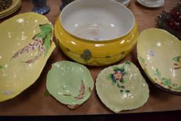 An unusual yellow Carlton Ware fruit bowl alongside a selection of Carlton Ware dishes.