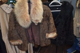 Three vintage ladies coats including two astrakhan coats, both with fox fur and similar collars.