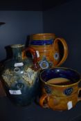 A collection of antique Royal Doulton including handled jugs/vases and large loving cup.