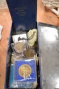 A tin full of collectable coins and currency, Royal wedding interest amongst the collection.