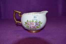 A Hand painted Spode Copeland china jug, signed EE Casson to underside.