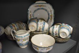 A collection of vintage Crown Staffordshire china having blue edging with floral transfer pattern,
