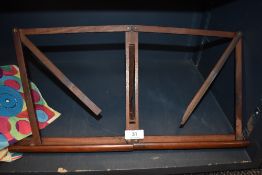 A folding wooden sheet music stand.