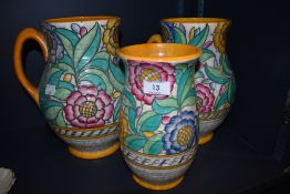 Two impressively sized Charlotte Rhead Crown Ducal jugs and a vase, all signed and numbered 4040