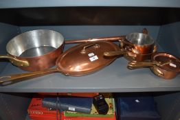 A set of good quality copper pans and a copper horn.