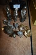 A collection of metal animal figurines including dog,cat,birds and squirrels.