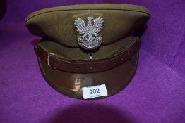 A military officers style cap having British cloth cap badge and label reading 03 79r 57