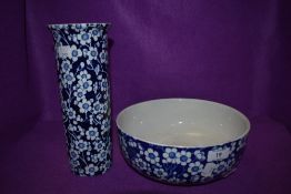 A Woods 'Prunus' fruit bowl and a vase, both having Blue ground with white floral pattern.