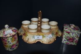 A Royal Devon egg cup holder with tray,AF and two Royal Winton 'Summertime' preserve jars.