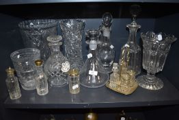 A good quantity of vintage glass ware including decanters, condiment sets and vases.