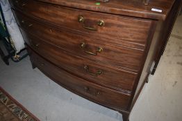 A 19th Century mahogany chest of four long drawers having aesthetic style drop handles and splay