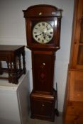 An early 20th Century mahogany low height, long case clock having inlay decoration to trunk and
