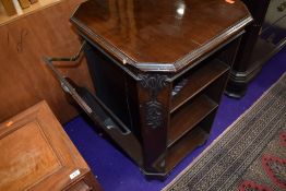 A late 19th or ealry 20th Centurt mahogany booktable having open shelves to side and interesting