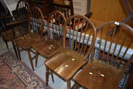 A matched set of five (four plus one) kitchen chairs including Ercol