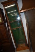 A 19th Century oak glazed display cabinet, originally used as a shop display for fishing rods (