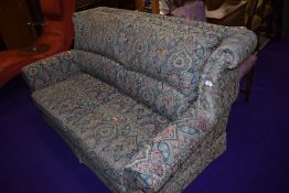 A vintage settee in floral upholstery