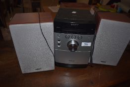 A Sony CMT - EH15 hifi unit with speakers