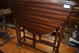 An early 20th Century mahogany narrow gateleg table on cabriole legs