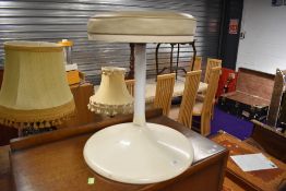 A vintage stool having toughened plastic mushroom style base, metal column and vinyl top