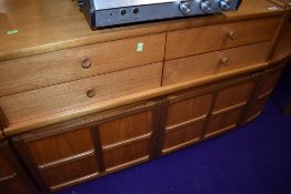 A Nathan teak short sideboard of two over two drawers over double cupboard, width approx. 102cm