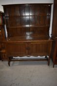 A traditional oak dresser having plate rack on double cupboard base, probably early 20th Century ,