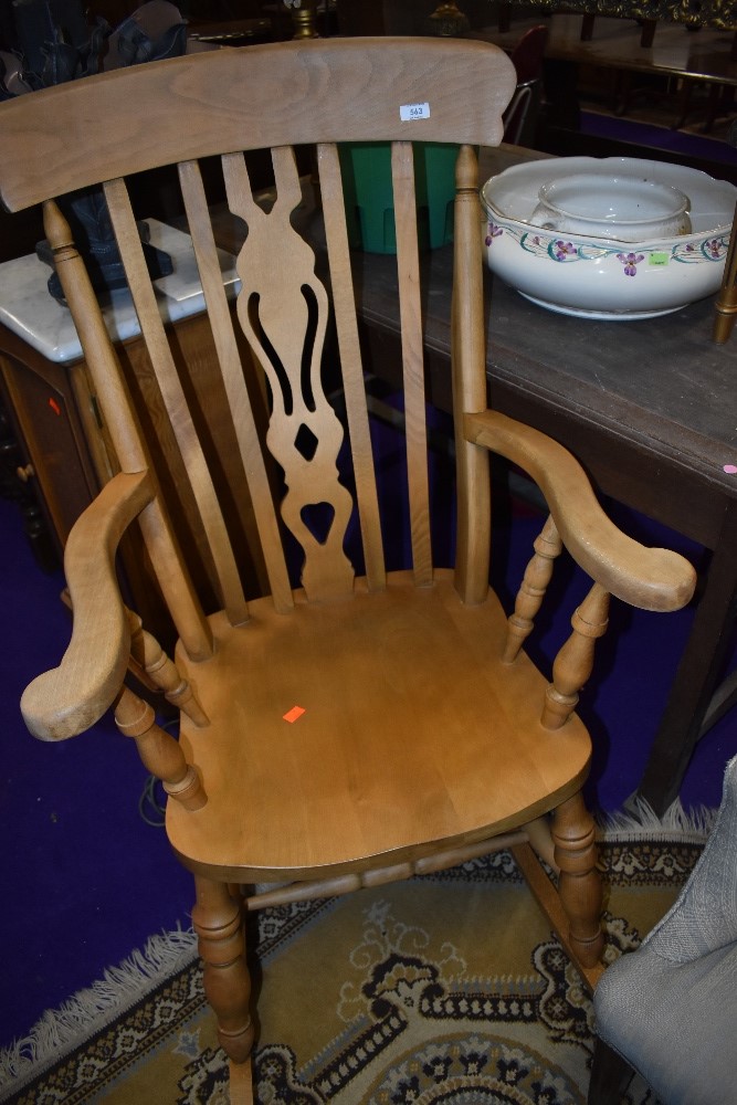 A traditional beech rocking chair