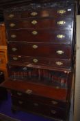 A Georgian mahogany secretaire chest on chest, greek key cornice, possibly later mask decoration,