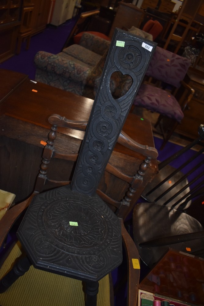 A traditional carved kitting chair