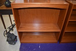 A teak effect bookshelf, approx width 90cm