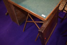 A traditional folding card table and a mahogany tray style table