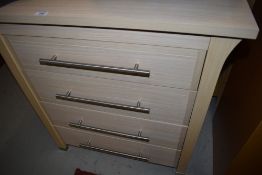 A laminate chest of four drawers, width approx. 67cm