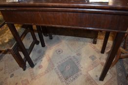 A Victorian mahogany fold over tea table, width approx. 86cm, depth 44cm