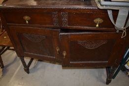 An early 20th Century oak and ply sideboard, width approx 107cm