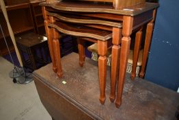 A stained frame nest of three table, serpemtine fronts, top table width approx. 56cm