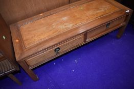 An Oriental hardwood coffee table having frieze drawers, approx. 115 x 43cm