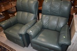 Two modern green leatherette easy chairs