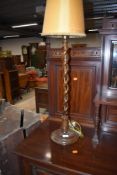 An early 20th Century oak open twist table lamp, height approx. 60cm to fitting