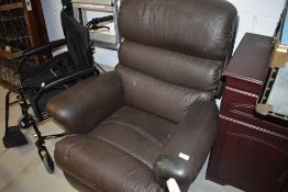 A brown leather style easy chair recliner
