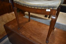 A Queen Anne style bow topped dressing table stool on Cabriole legs