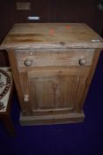 A stripped pie bedside pot cupboard, bit shabby but sound for restoration or upcycling