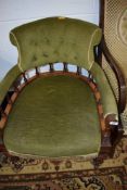 A Victorian mahogany tub chair, having bobbin back and green upholstery